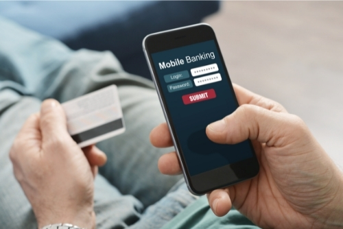 Person using phone to log in to online banking