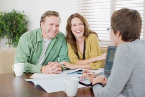 Husband and wife meeting with representative