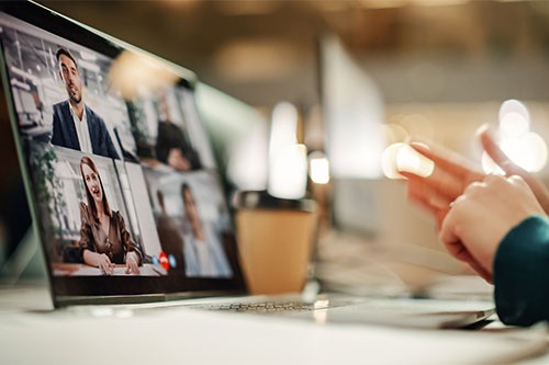 Person sitting at desk taking virtual Zoom call